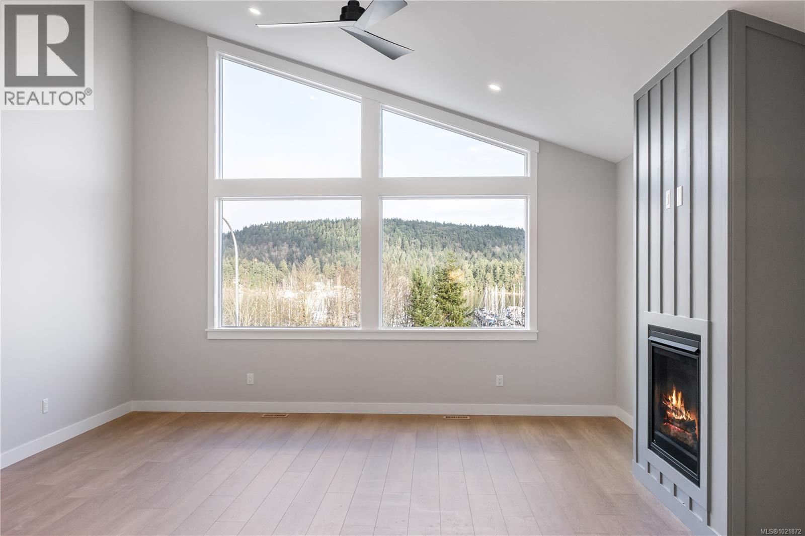 Similar Home - 151 Marina View Dr, Ladysmith, BC - Indoor Photo Showing Other Room With Fireplace