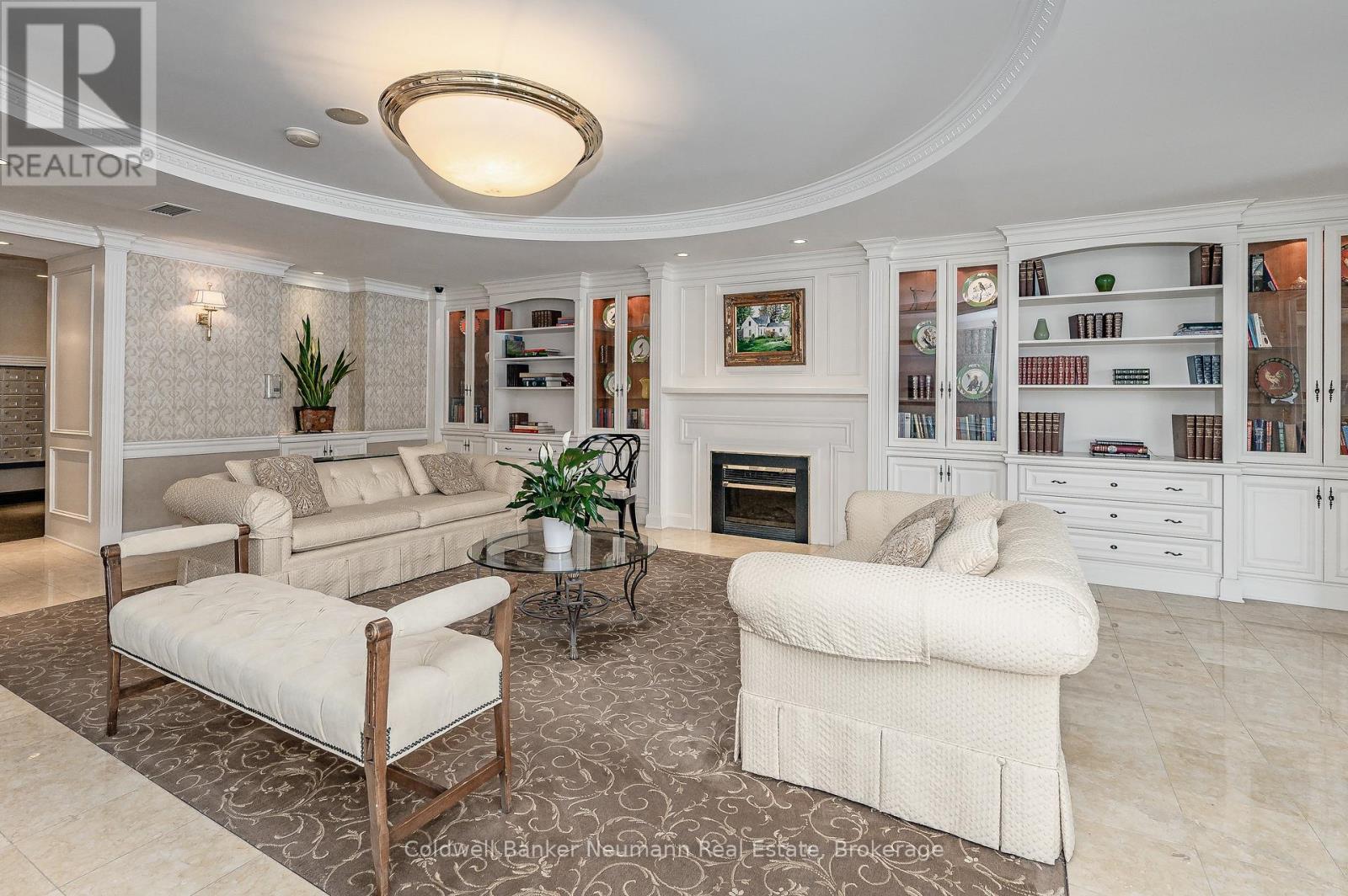 409 - 60 Old Mill Road, Oakville (Oo Old Oakville), ON - Indoor Photo Showing Living Room With Fireplace