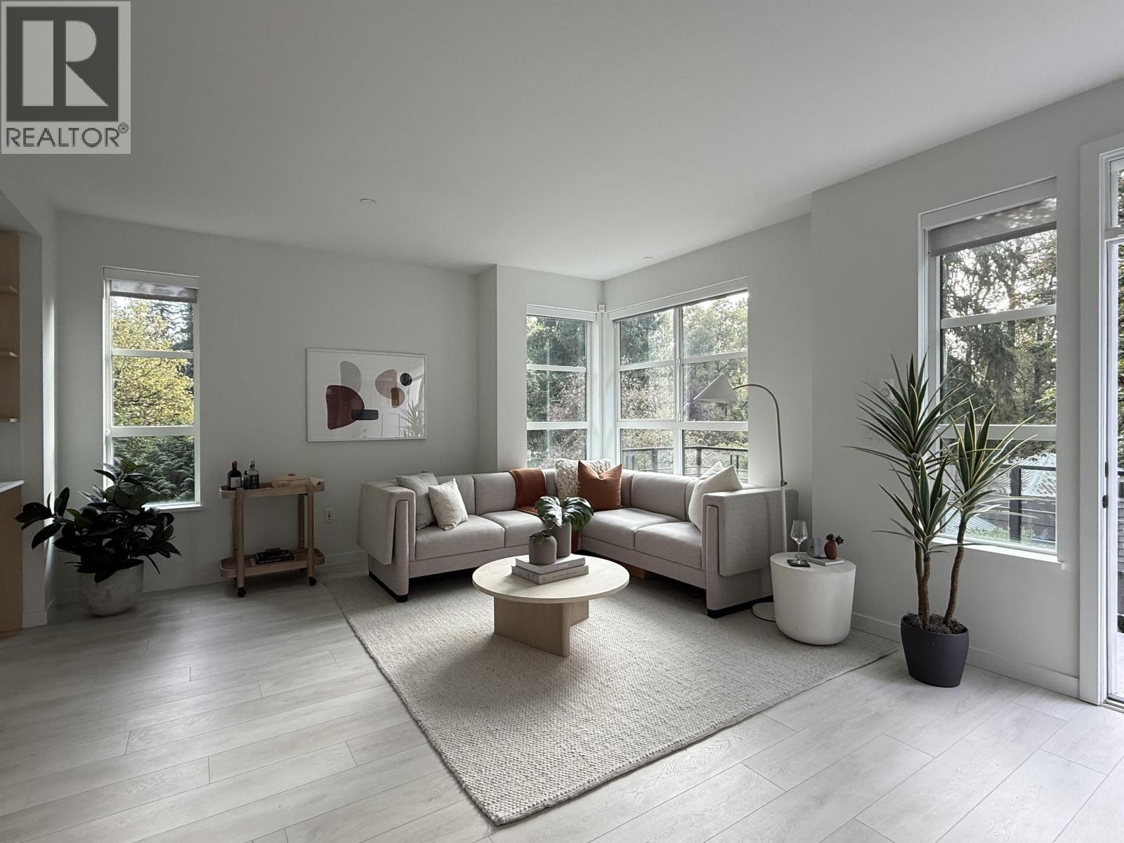 210 2045 Heritage Park Lane, North Vancouver, BC - Indoor Photo Showing Living Room