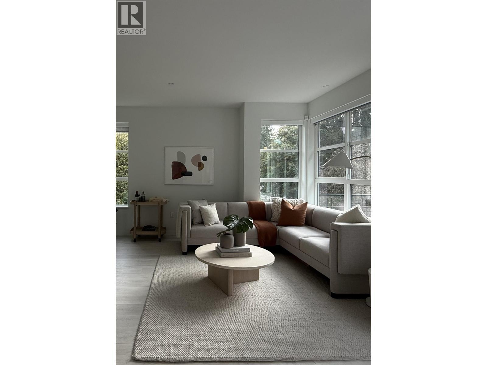 210 2045 Heritage Park Lane, North Vancouver, BC - Indoor Photo Showing Living Room