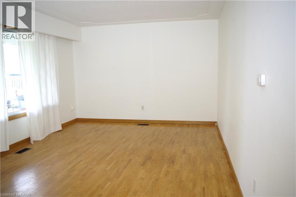 Unfurnished room featuring light wood finished floors and baseboards - 425 Wellington Street E, Mount Forest, ON - Indoor Photo Showing Other Room