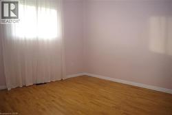 Spare room with light wood finished floors and baseboards -