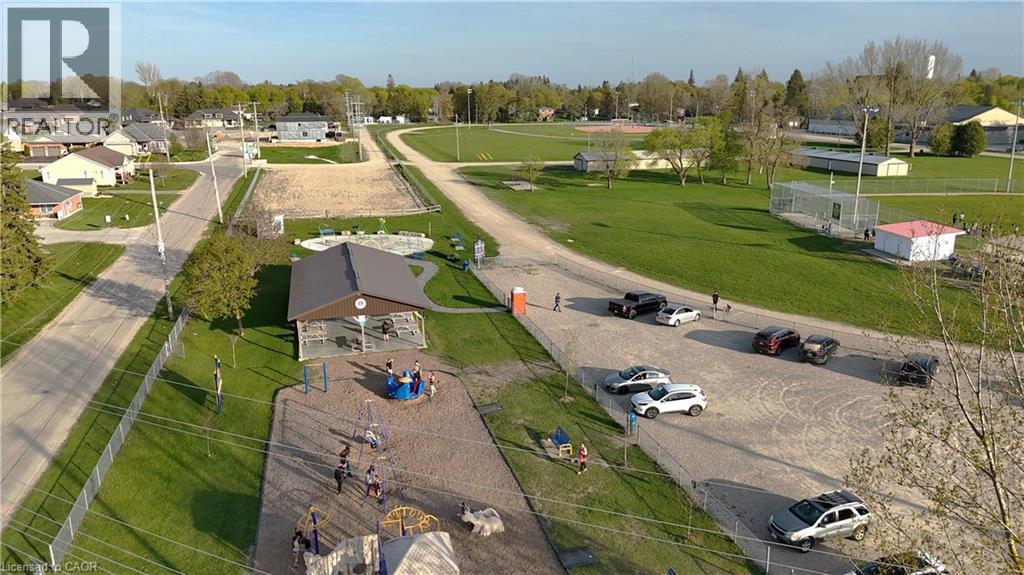 Aerial perspective of suburban area featuring a tree filled landscape - 425 Wellington Street E, Mount Forest, ON - Outdoor With View