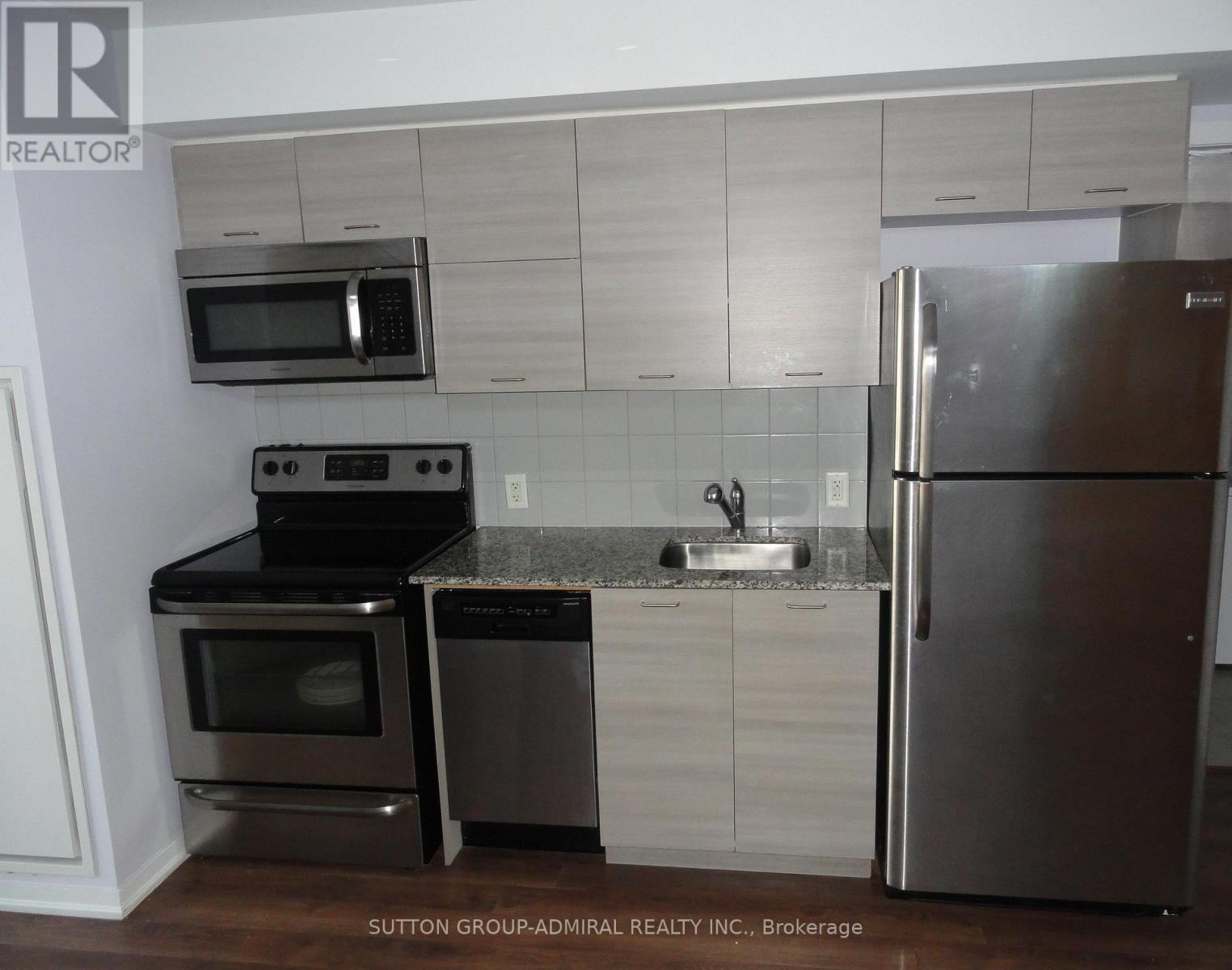 702 - 20 Joe Shuster Way, Toronto, ON - Indoor Photo Showing Kitchen With Upgraded Kitchen