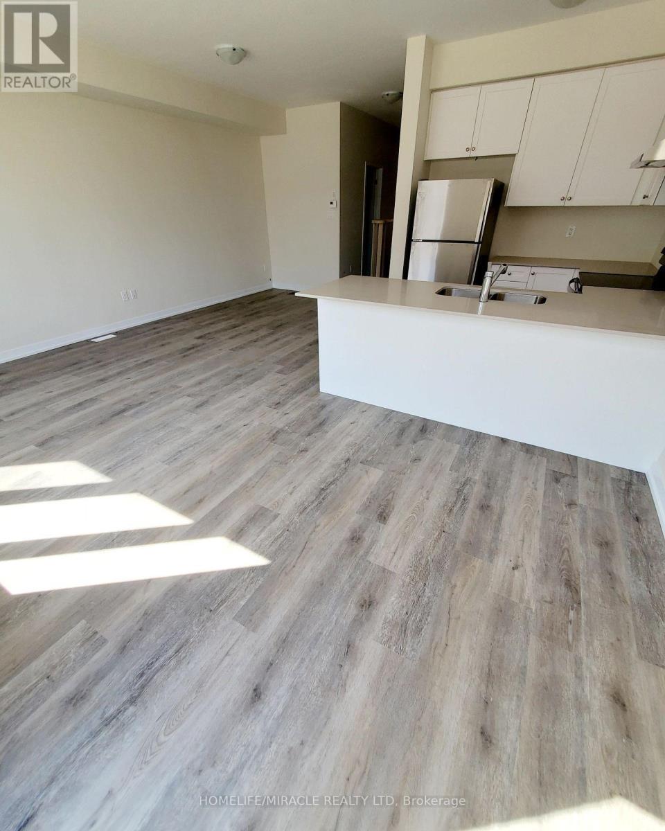 2 - 7789 Kalar Road, Niagara Falls, ON - Indoor Photo Showing Kitchen With Double Sink