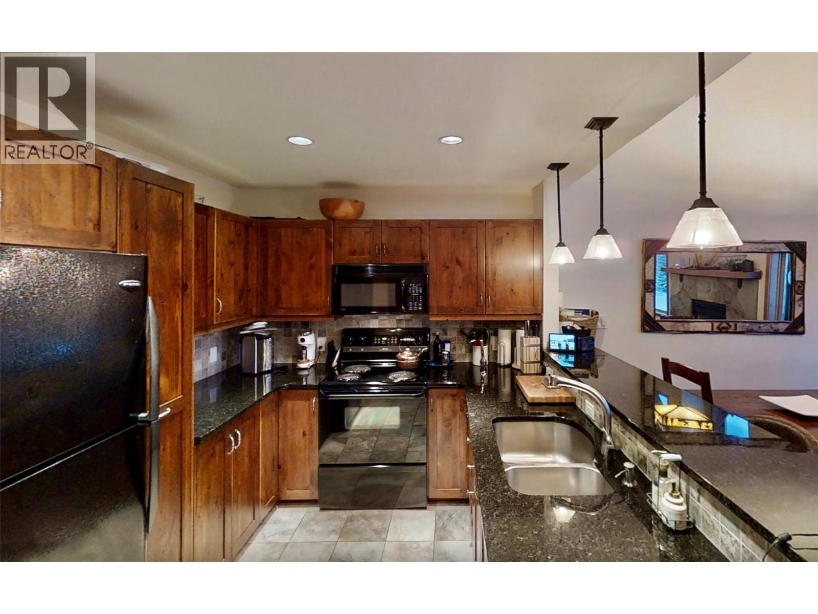 1336 Palliser Trail Unit# 9, Golden, BC - Indoor Photo Showing Kitchen With Double Sink