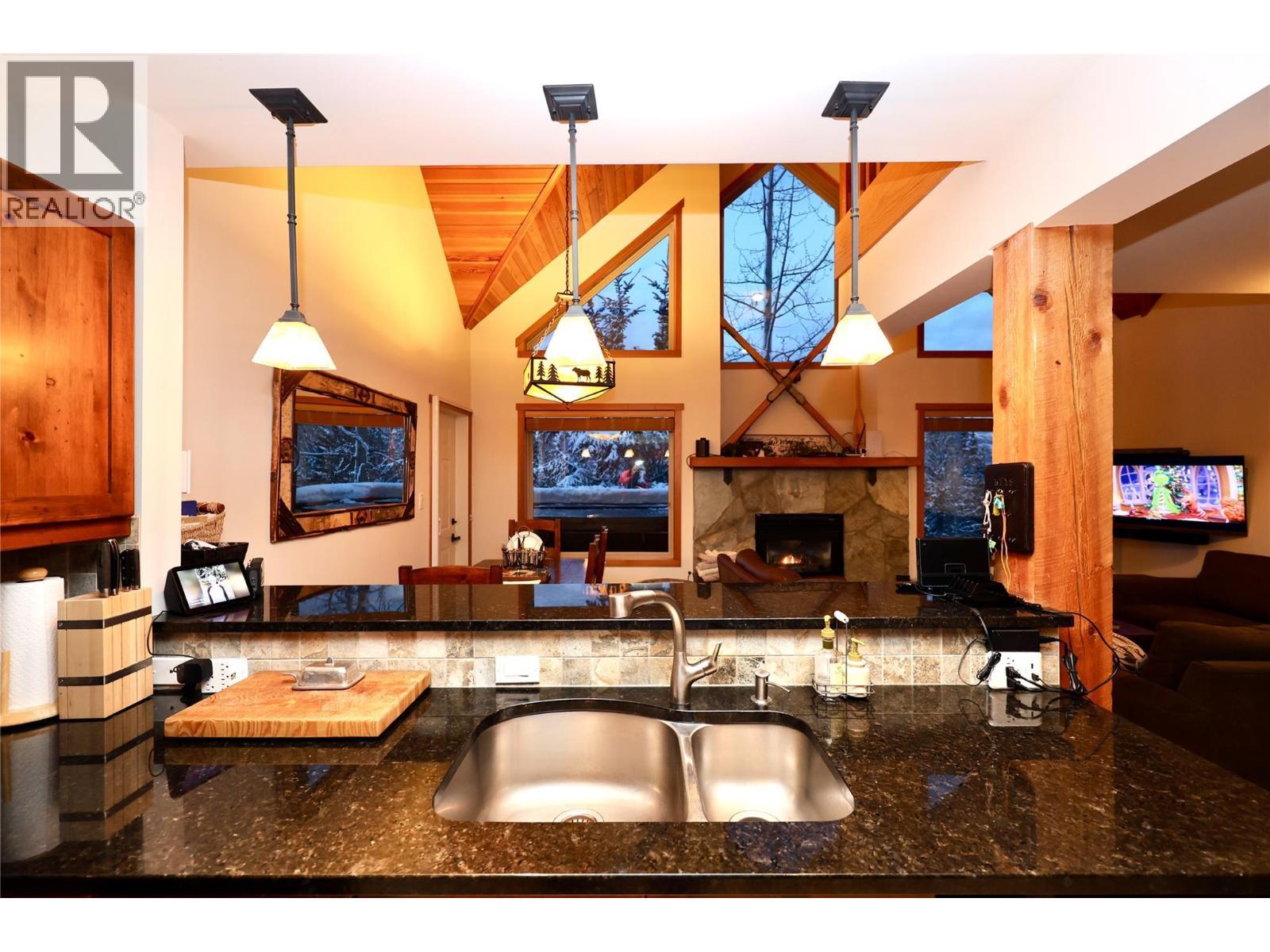 1336 Palliser Trail Unit# 9, Golden, BC - Indoor With Fireplace