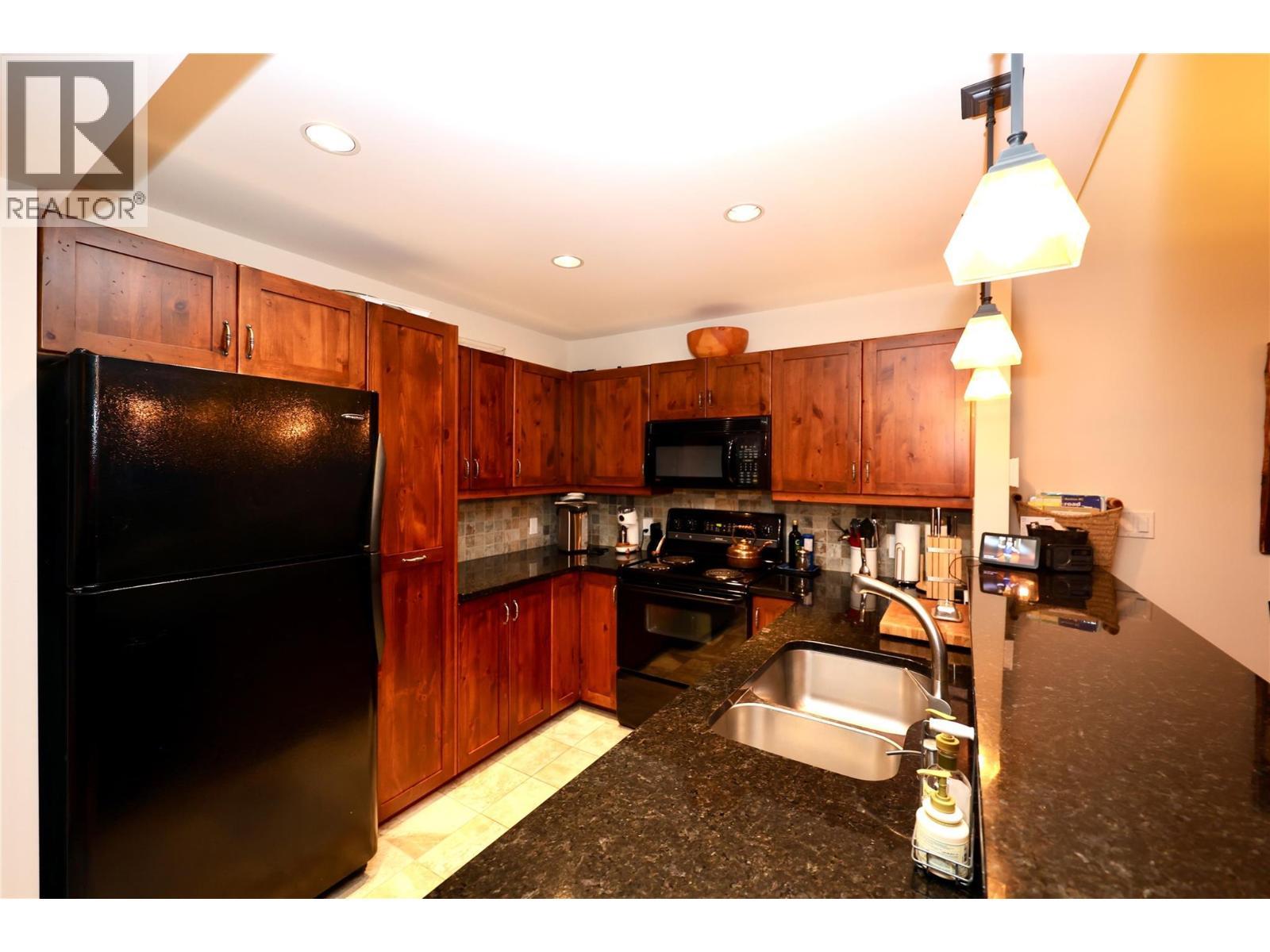 1336 Palliser Trail Unit# 9, Golden, BC - Indoor Photo Showing Kitchen With Double Sink