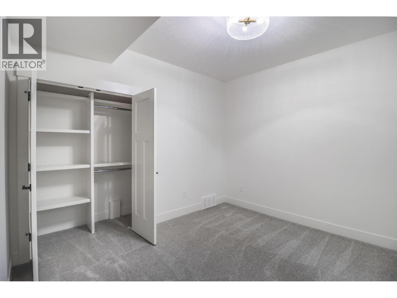 covered rear deck - 128 Shadow Mountain Boulevard, Cranbrook, BC - Outdoor With Deck Patio Veranda With Exterior