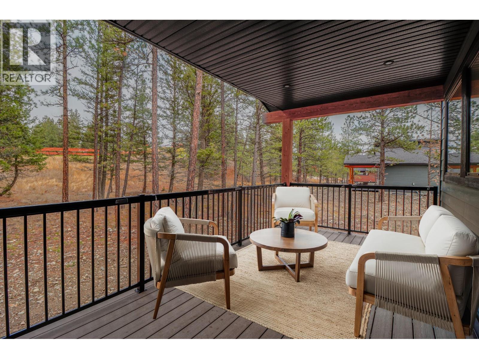 golf course club house - 128 Shadow Mountain Boulevard, Cranbrook, BC - Outdoor With Facade