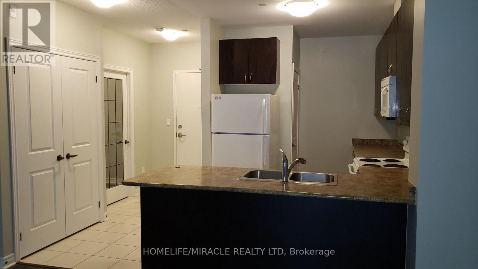 103 - 7400 Markham Road, Markham, ON - Indoor Photo Showing Kitchen With Double Sink