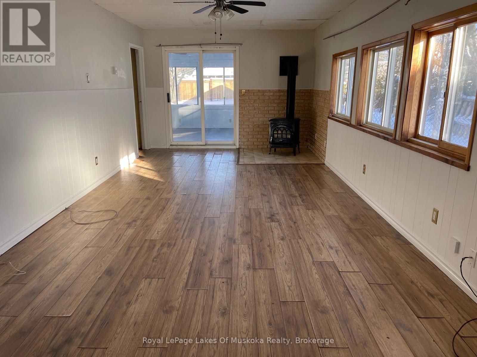 Large Family room with gas fireplace - 560 John Street N, Gravenhurst (Muskoka (S)), ON - Indoor Photo Showing Other Room