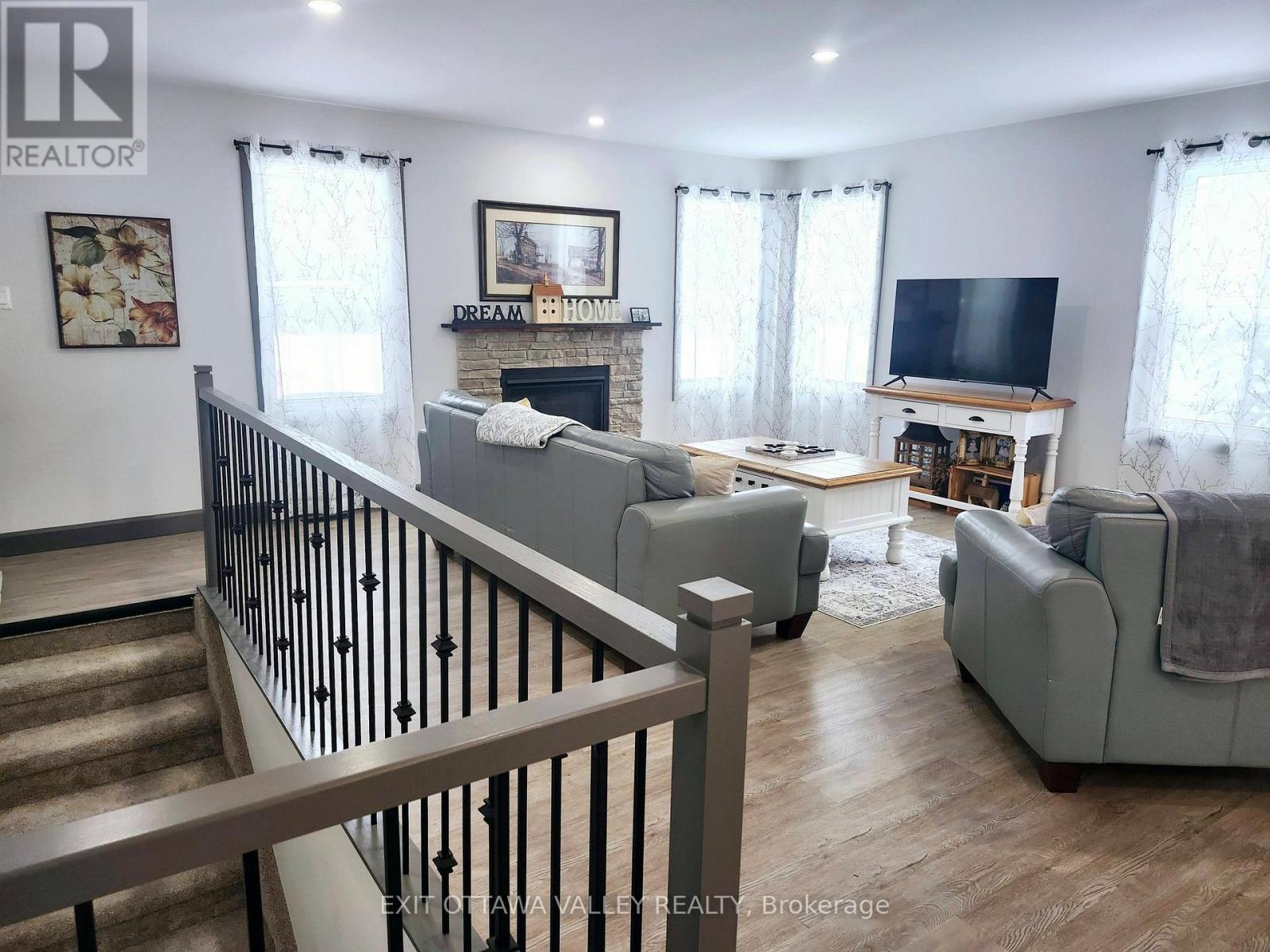 1485 Rapid Road, Whitewater Region, ON - Indoor Photo Showing Living Room With Fireplace