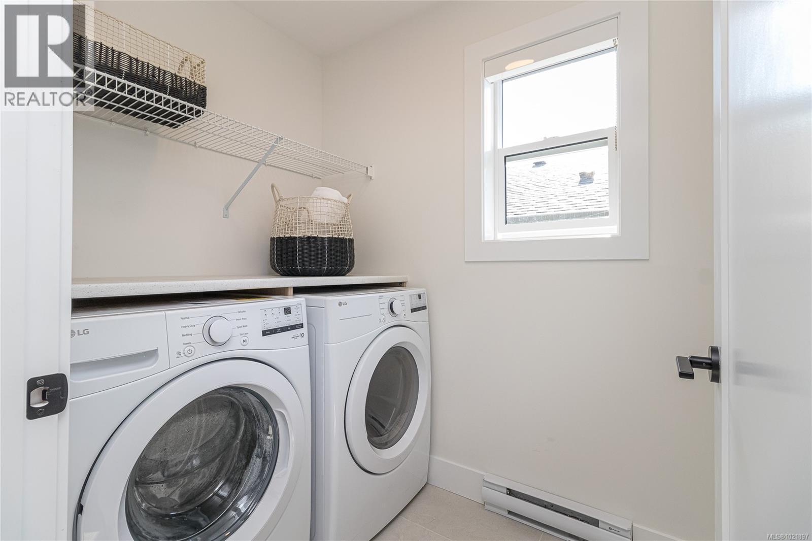 Photo not of this exact home, but one of similar construction. - 1426 Dolomite Ridge, Langford, BC - Indoor Photo Showing Laundry Room