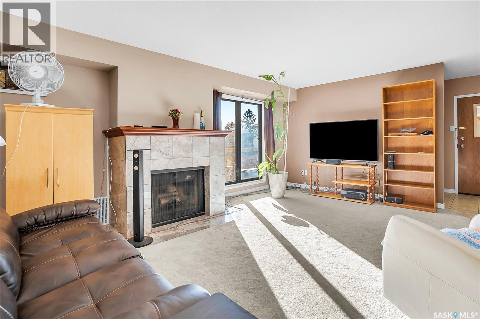302 437 Pendygrasse Road, Saskatoon, SK - Indoor Photo Showing Living Room With Fireplace