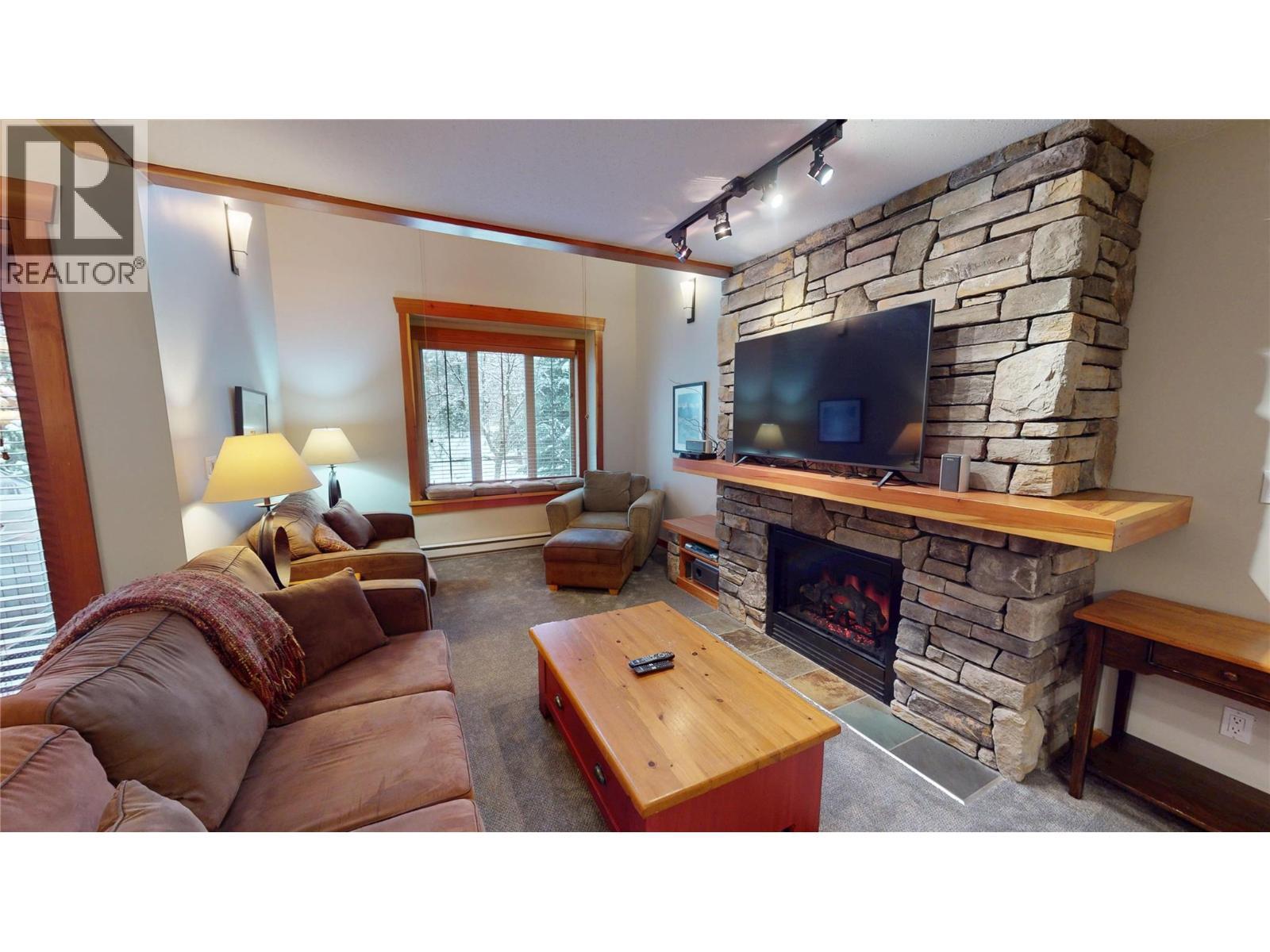 45 Rivermount Place Unit# 102D, Fernie, BC - Indoor Photo Showing Living Room With Fireplace