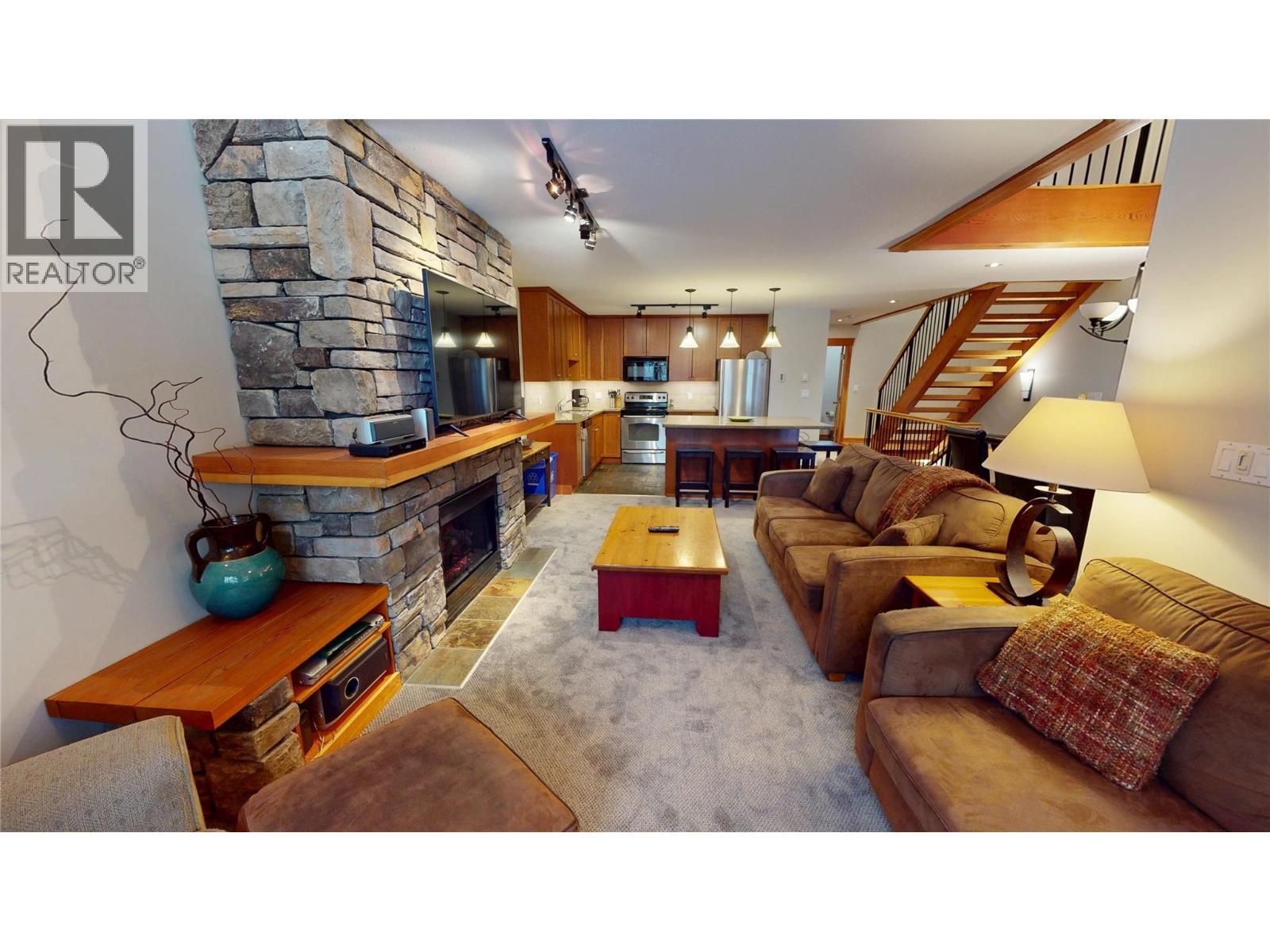 45 Rivermount Place Unit# 102D, Fernie, BC - Indoor Photo Showing Other Room With Fireplace