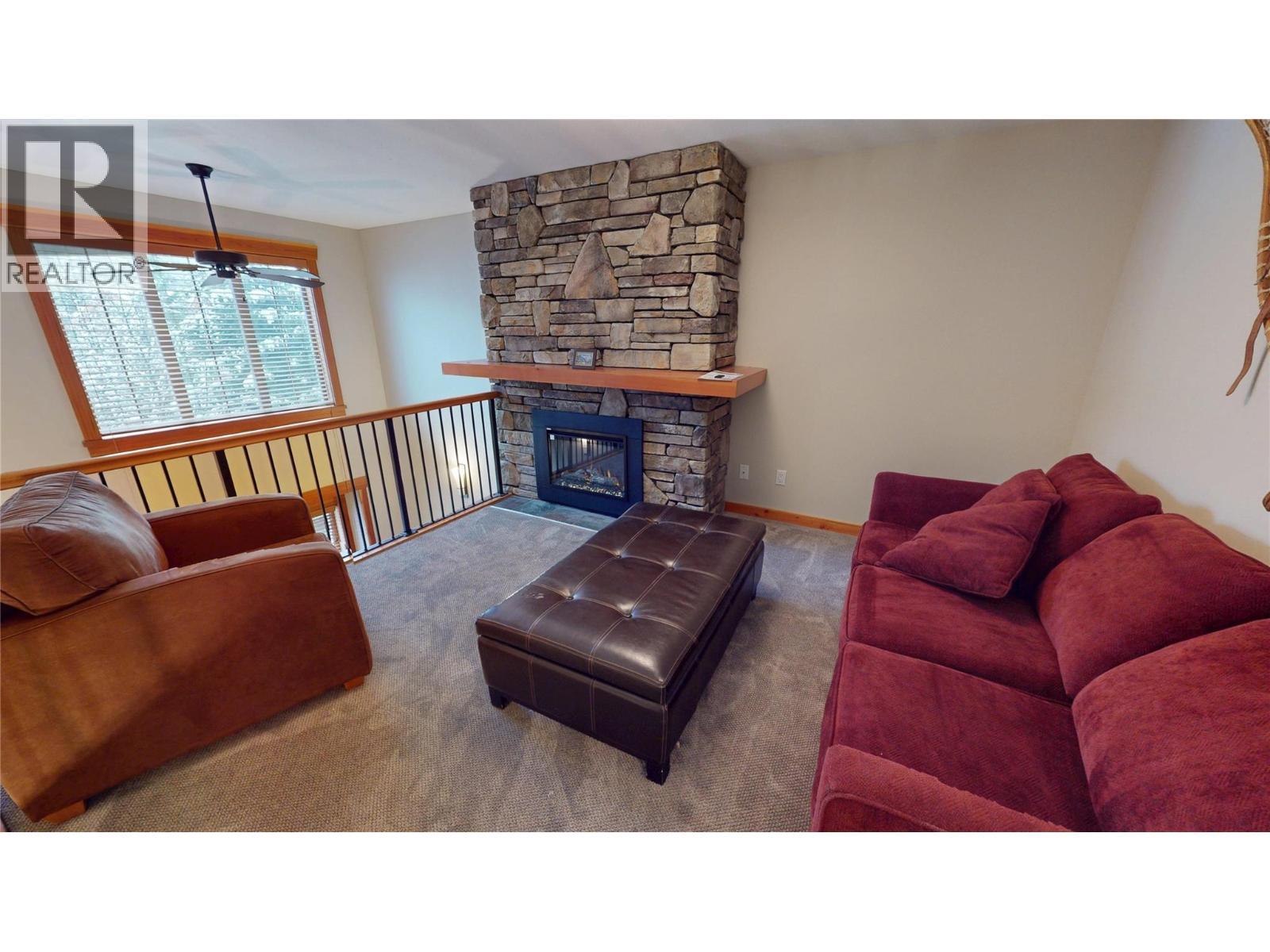 45 Rivermount Place Unit# 102D, Fernie, BC - Indoor Photo Showing Living Room With Fireplace