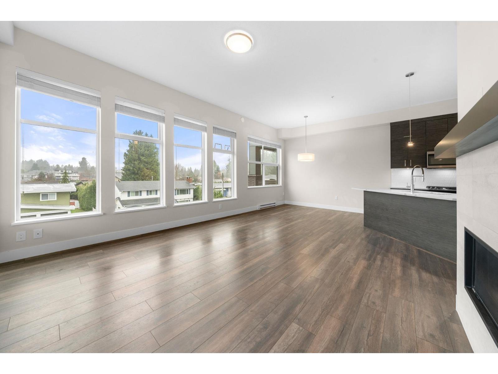 312 2120 Gladwin Road, Abbotsford, BC - Indoor Photo Showing Living Room With Fireplace