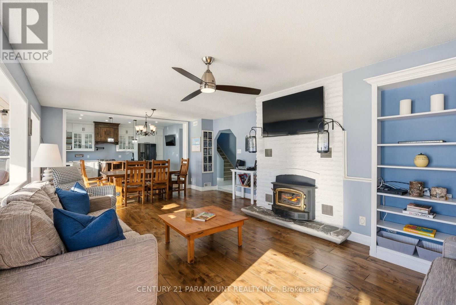 126 Chapman Drive Se, Magnetawan, ON - Indoor Photo Showing Living Room With Fireplace