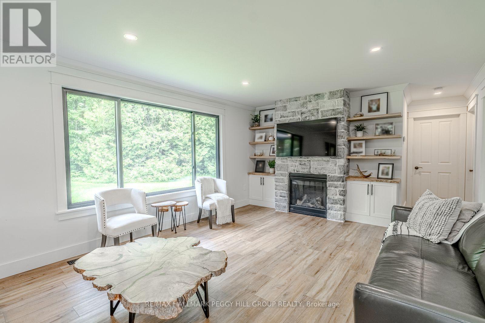 2764 Fairgrounds Road, Severn, ON - Indoor Photo Showing Living Room With Fireplace