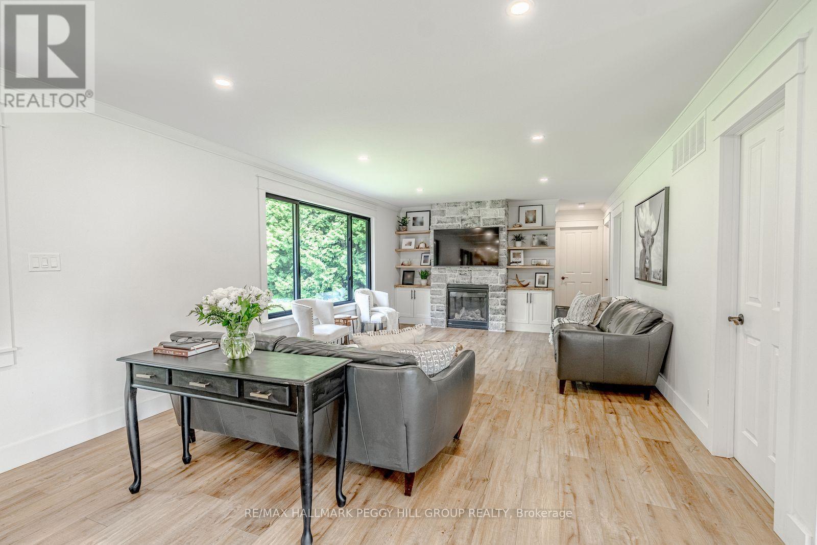 2764 Fairgrounds Road, Severn, ON - Indoor Photo Showing Living Room With Fireplace