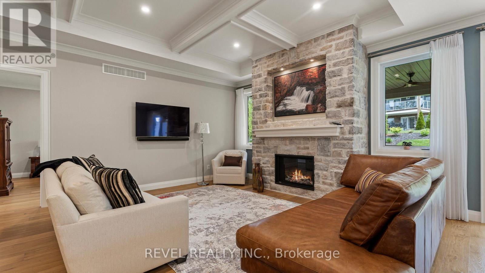 52 Beechnut Lane, Norfolk, ON - Indoor Photo Showing Living Room With Fireplace