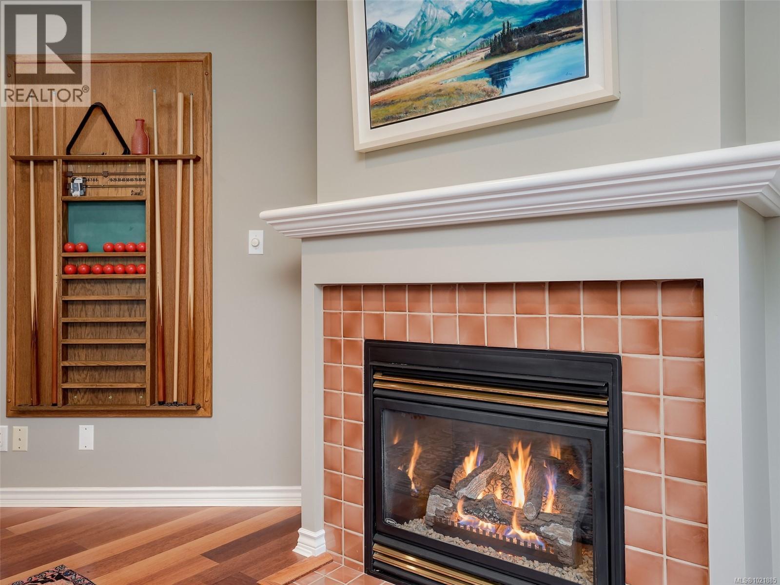 25 1286 Tolmie Ave, Saanich, BC - Indoor Photo Showing Living Room With Fireplace