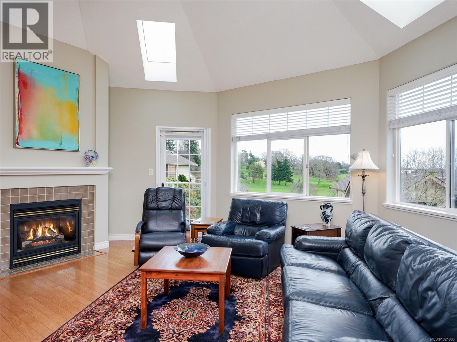 25 1286 Tolmie Ave, Saanich, BC - Indoor Photo Showing Living Room With Fireplace