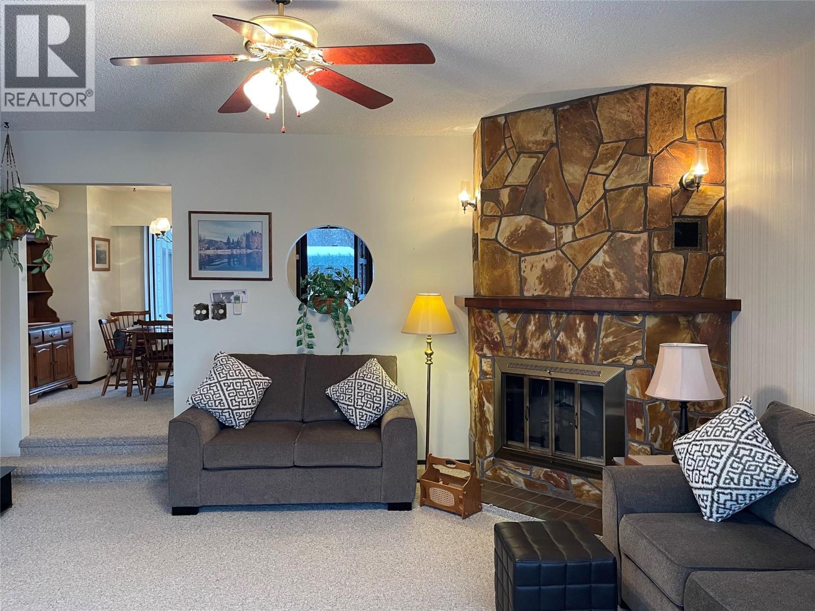 1995 Kelly Court, Christina Lake, BC - Indoor Photo Showing Living Room With Fireplace