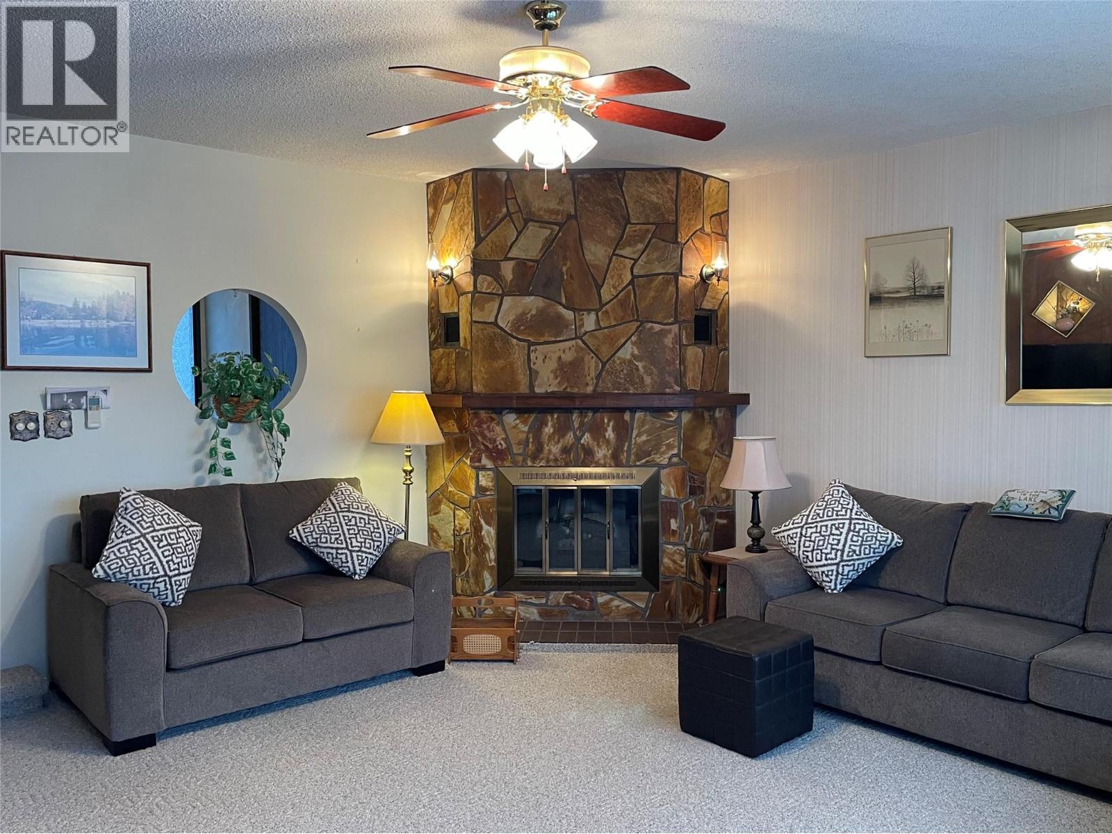 1995 Kelly Court, Christina Lake, BC - Indoor Photo Showing Living Room With Fireplace