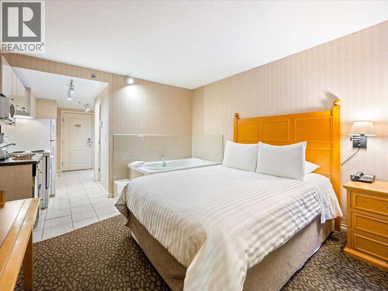 215 4319 Main Street, Whistler, BC - Indoor Photo Showing Bedroom