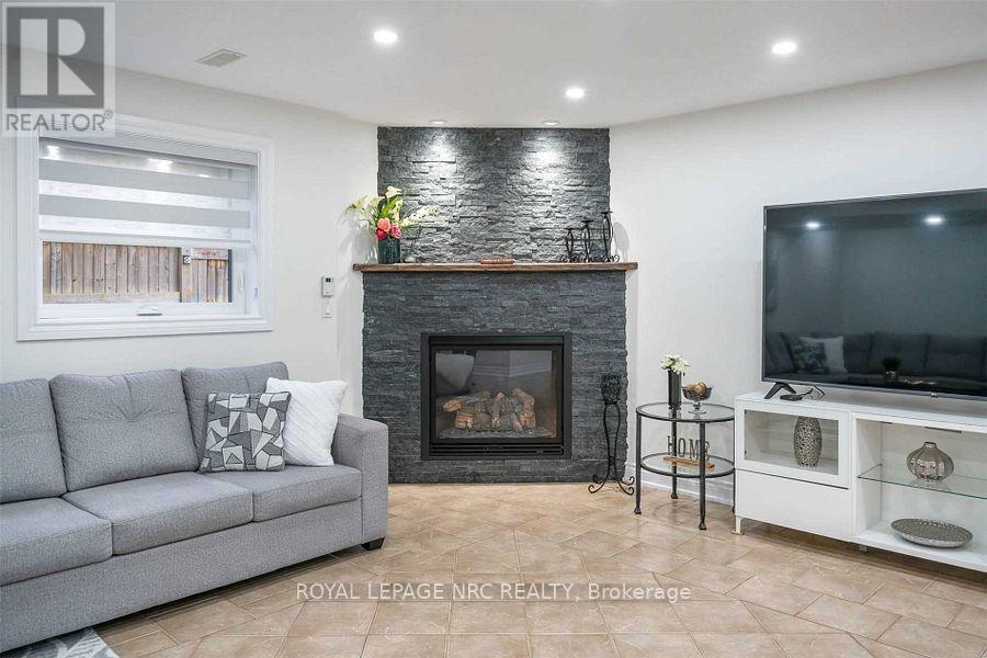 Basement - 89 Michelle Court, Welland (Broadway), ON - Indoor Photo Showing Living Room With Fireplace