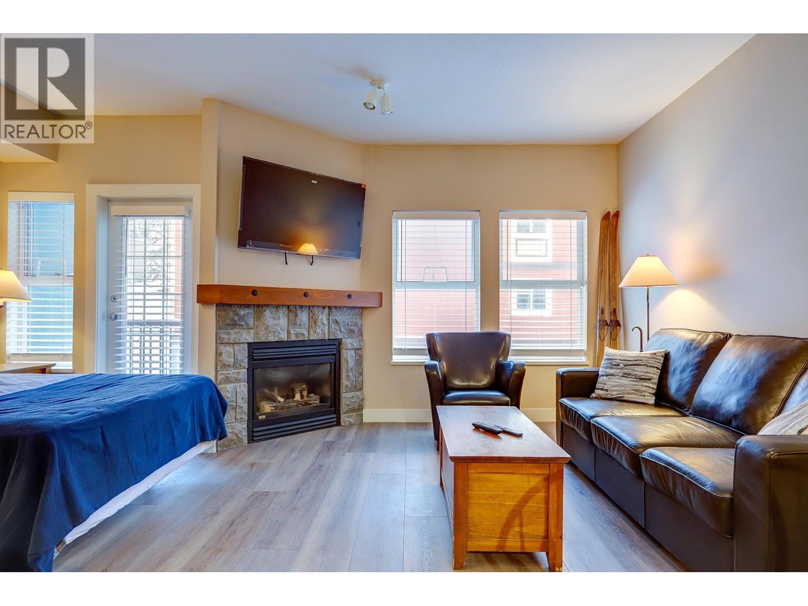 155 Silver Lode Lane Unit# 456, Silver Star, BC - Indoor Photo Showing Living Room With Fireplace