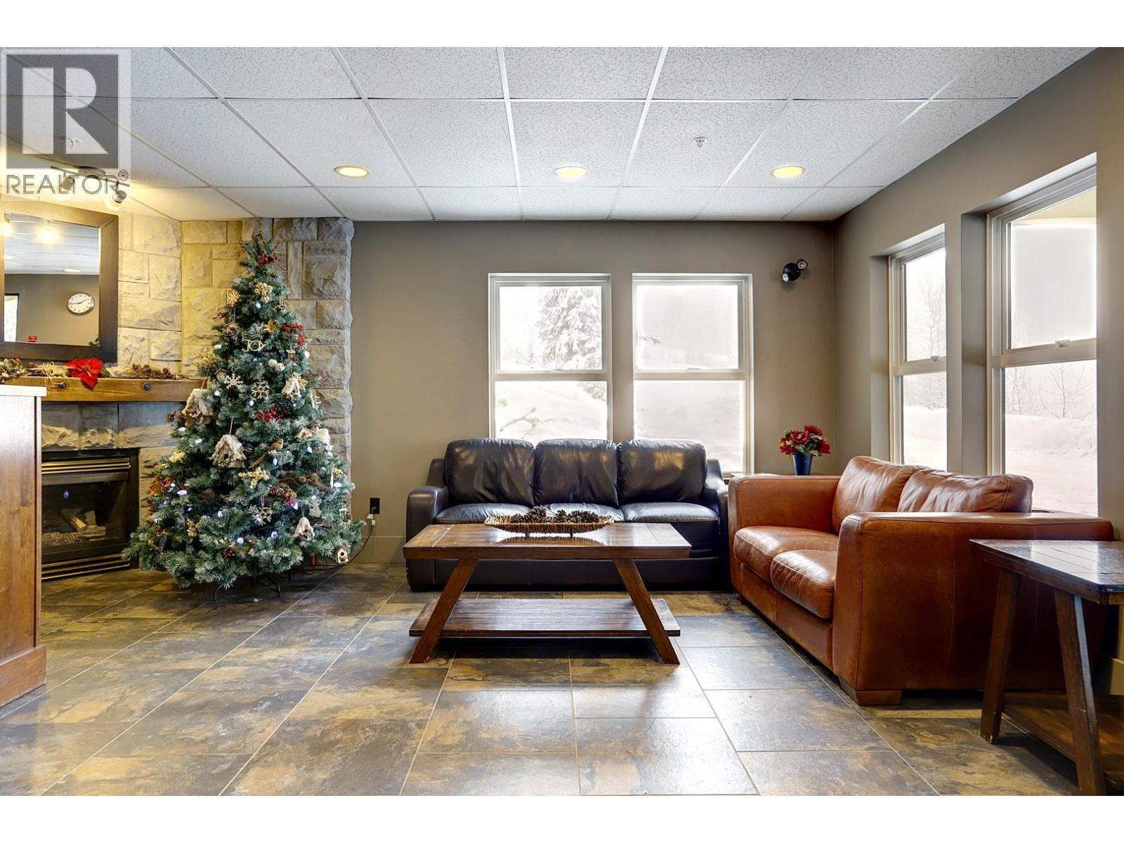 155 Silver Lode Lane Unit# 456, Silver Star, BC - Indoor Photo Showing Living Room With Fireplace