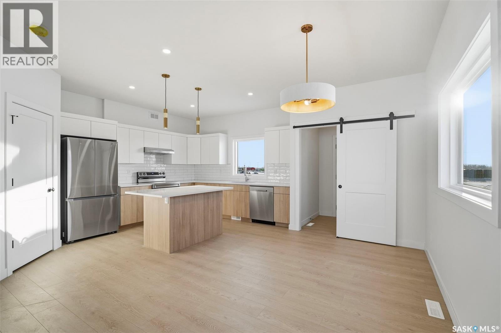 1408 Besnard Drive, Martensville, SK - Indoor Photo Showing Kitchen With Stainless Steel Kitchen With Upgraded Kitchen
