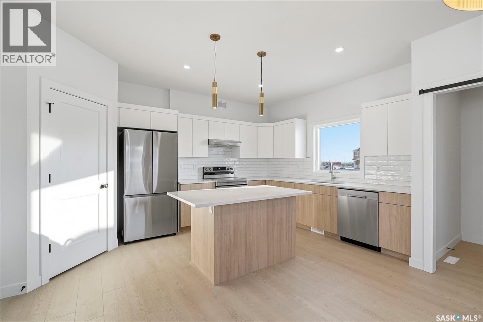 1408 Besnard Drive, Martensville, SK - Indoor Photo Showing Kitchen With Stainless Steel Kitchen With Upgraded Kitchen
