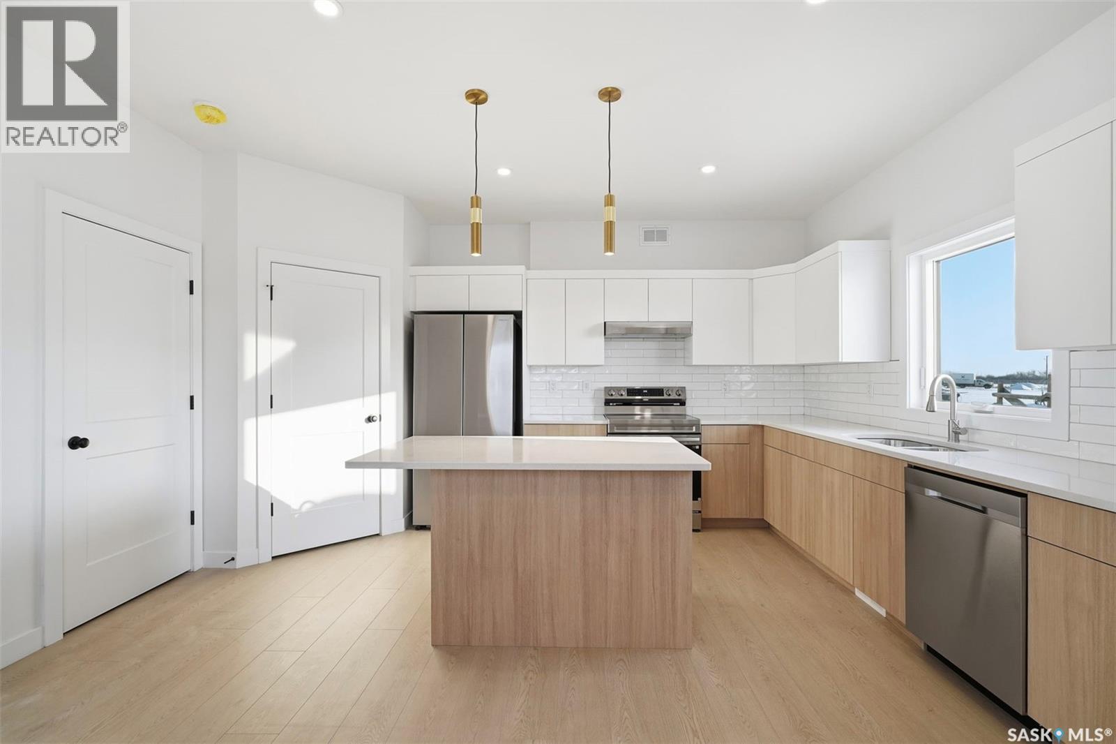 1408 Besnard Drive, Martensville, SK - Indoor Photo Showing Kitchen With Stainless Steel Kitchen With Upgraded Kitchen