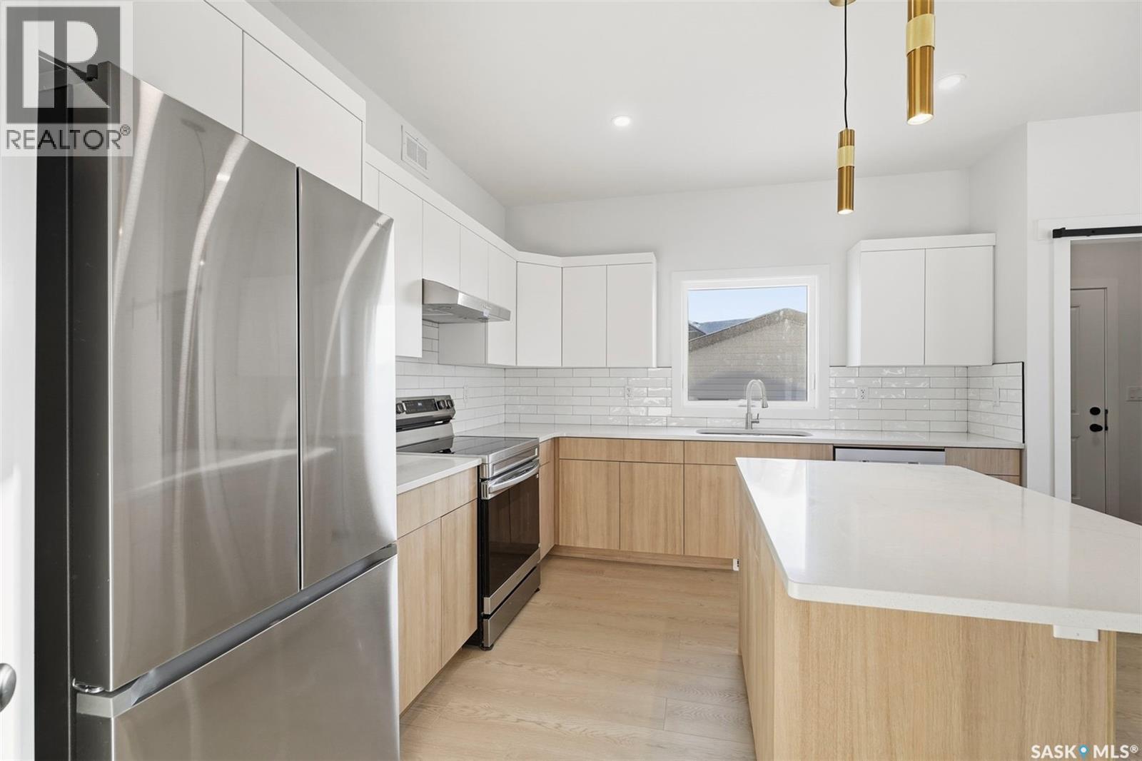 1408 Besnard Drive, Martensville, SK - Indoor Photo Showing Kitchen With Stainless Steel Kitchen With Upgraded Kitchen