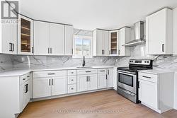 Stone countertops, modern fixtures. -