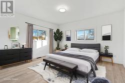 Virtually staged back unit bedroom 2. -