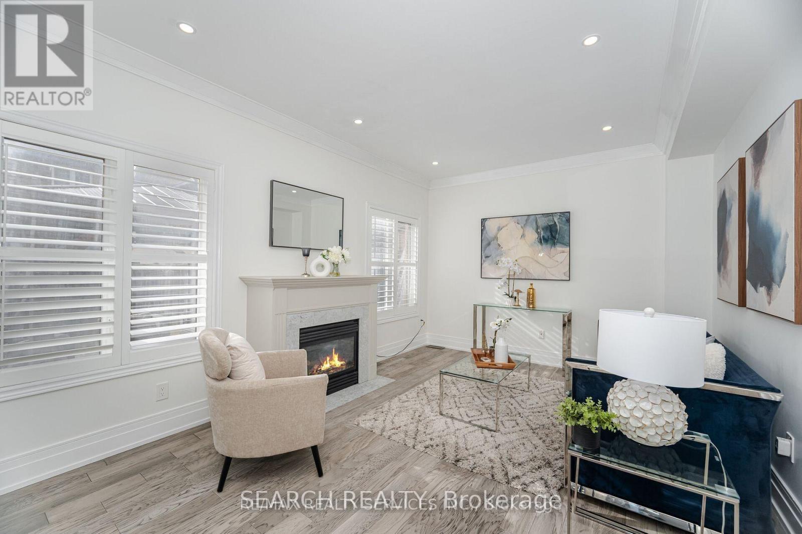 Upper - 20 Delmonico Road, Brampton, ON - Indoor Photo Showing Living Room With Fireplace