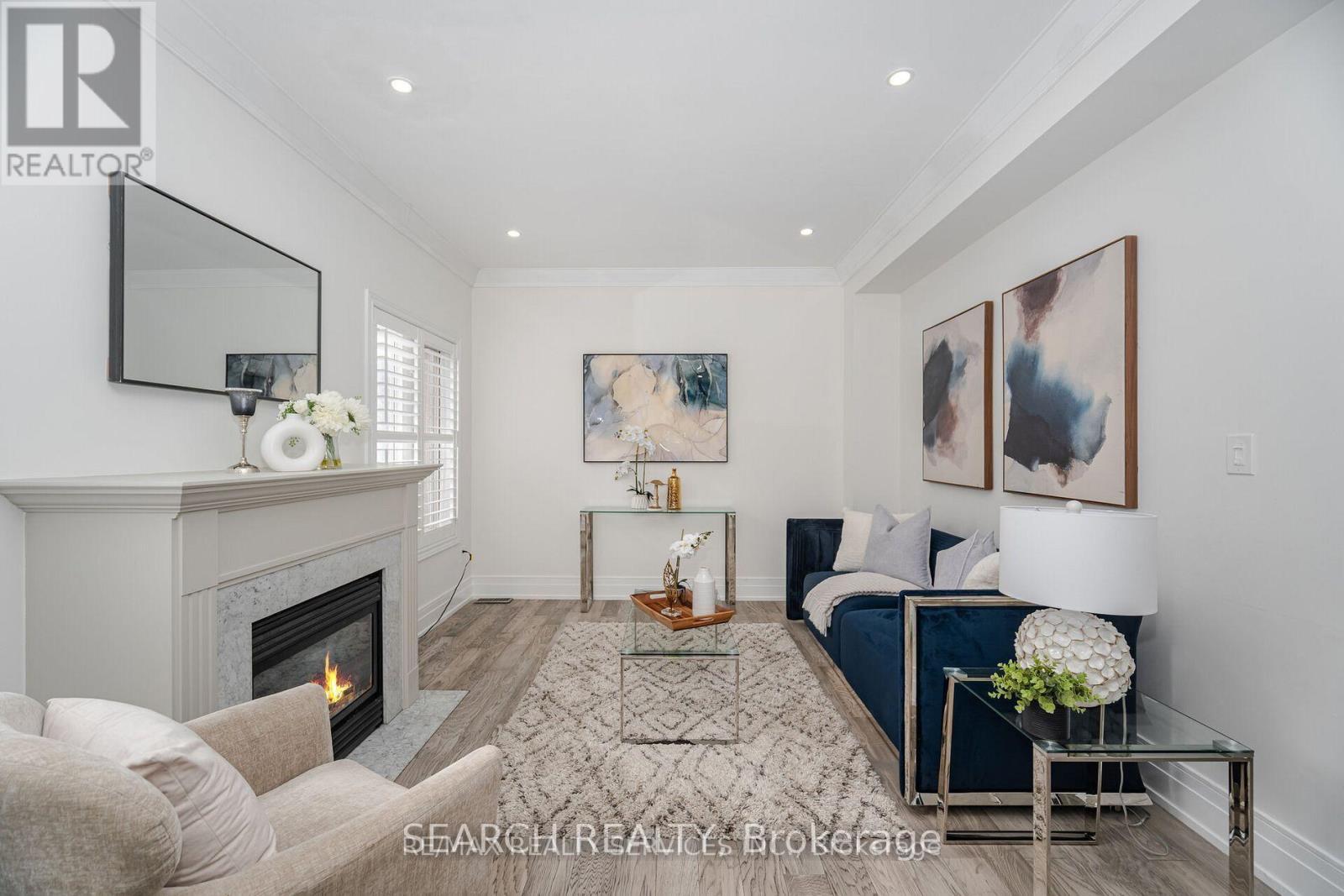 Upper - 20 Delmonico Road, Brampton, ON - Indoor Photo Showing Living Room With Fireplace