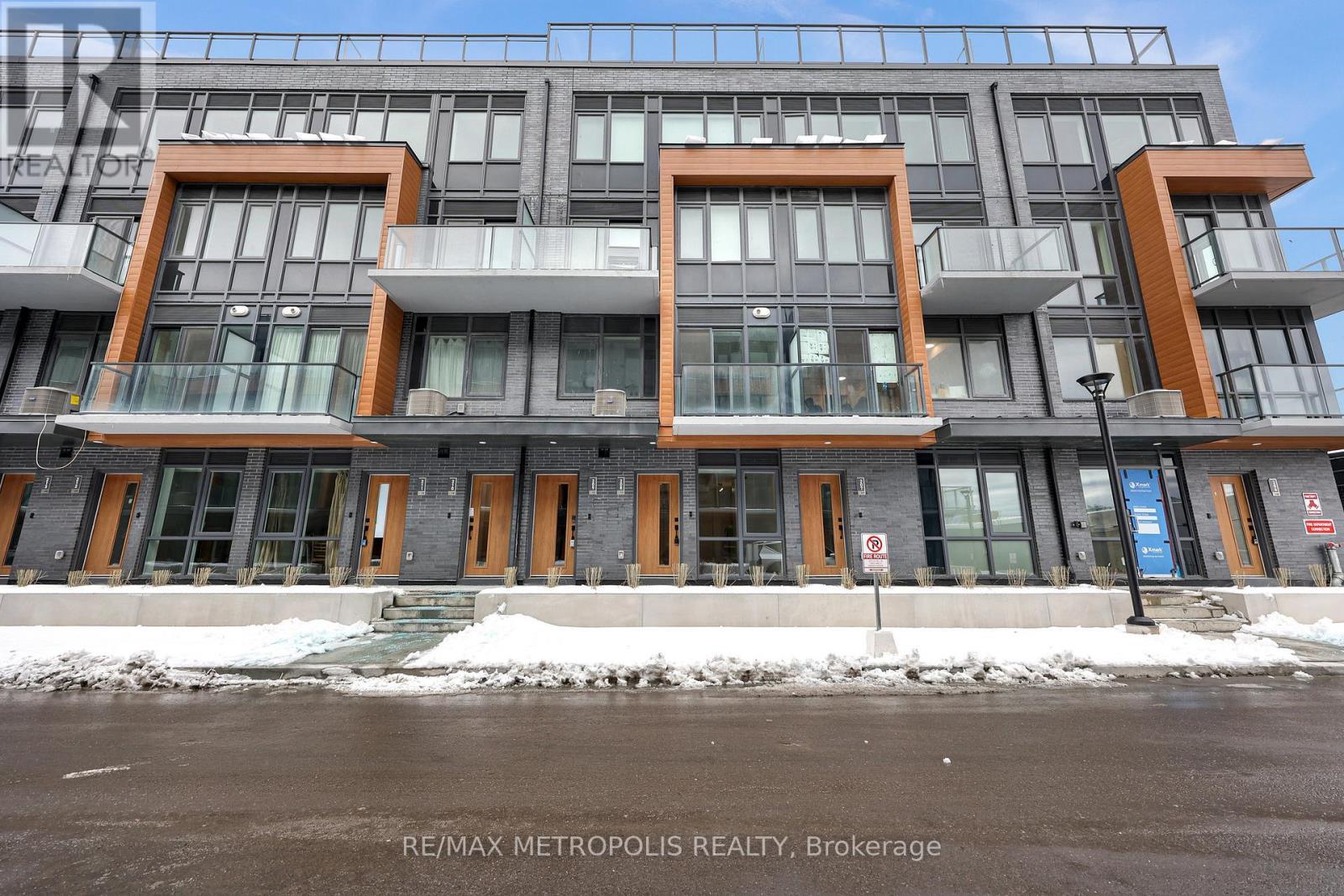 208 - 65 Curlew Drive, Toronto, ON - Outdoor With Balcony With Facade