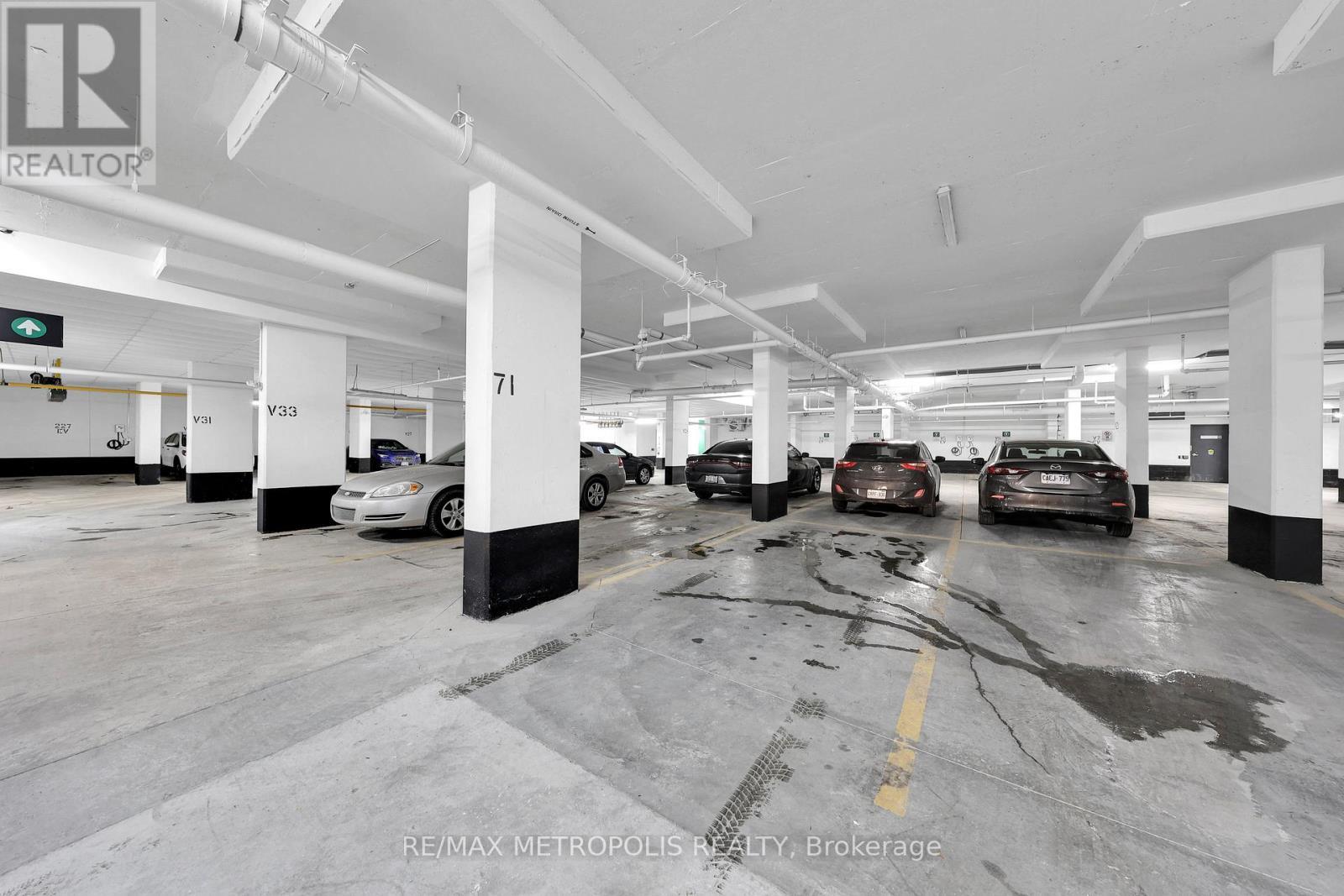 208 - 65 Curlew Drive, Toronto, ON - Indoor Photo Showing Garage