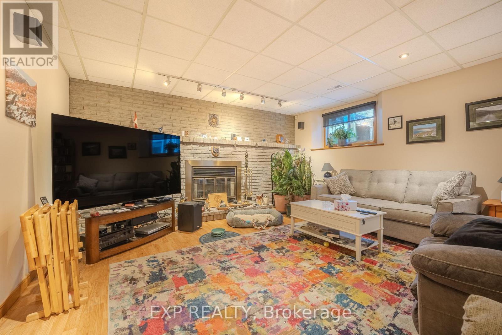 Family Room with Gas Fireplace - 6166 Wildrose Crescent, Niagara Falls (Oldfield), ON - Indoor Photo Showing Living Room With Fireplace