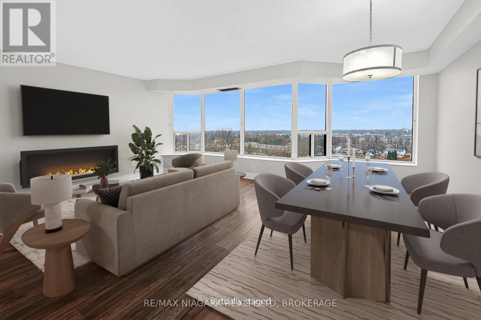 911 - 81 Scott Street, St. Catharines (Lakeport), ON - Indoor Photo Showing Living Room With Fireplace