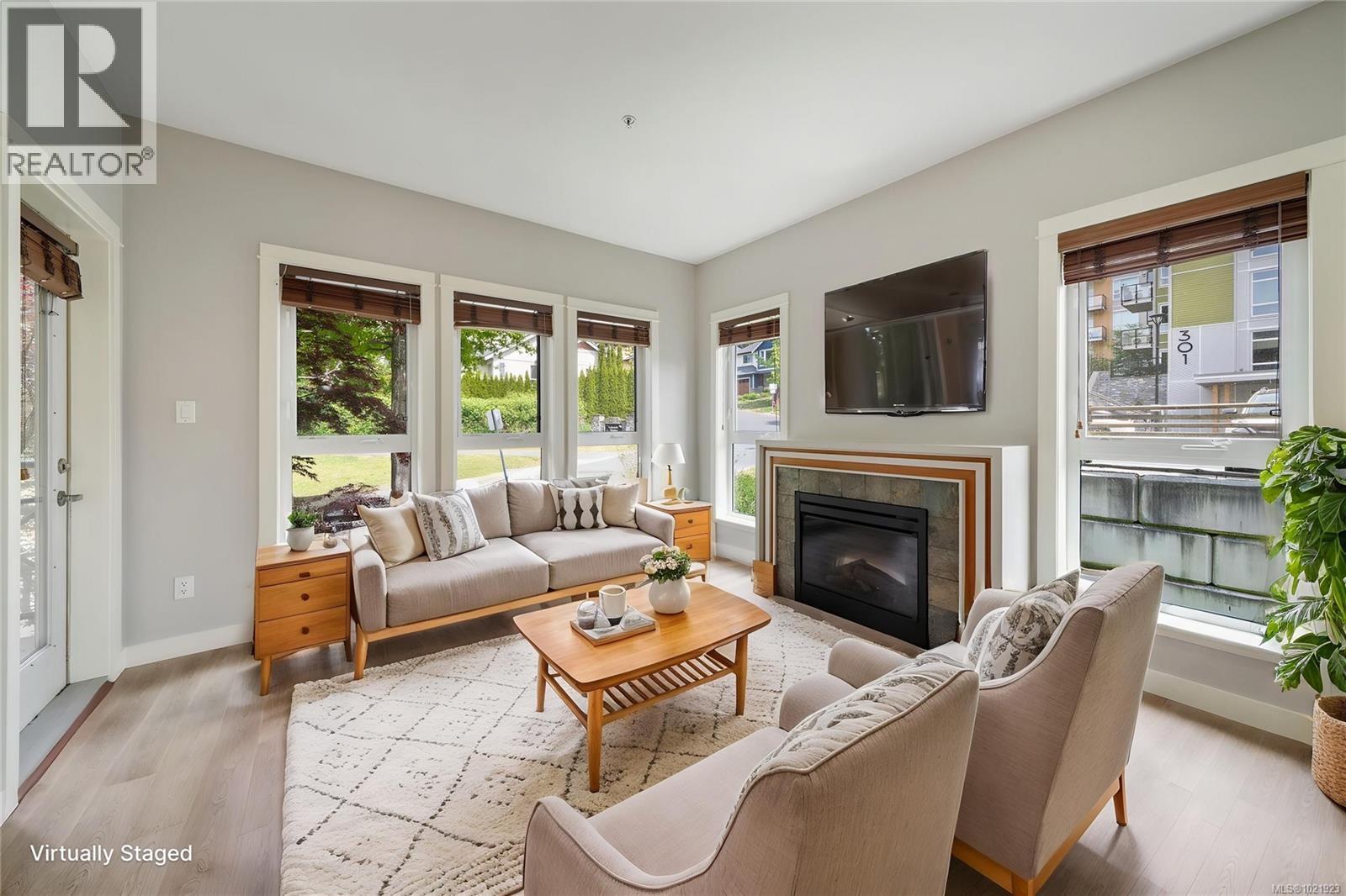 210 201 Nursery Hill Dr, View Royal, BC - Indoor Photo Showing Living Room With Fireplace