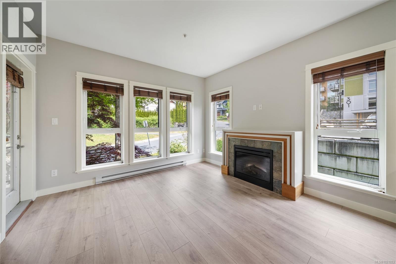 210 201 Nursery Hill Dr, View Royal, BC - Indoor Photo Showing Living Room With Fireplace