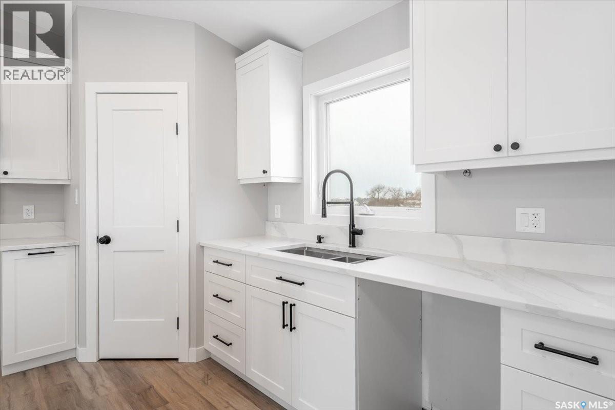 11 Jesse Bay, Mckillop Rm No. 220, SK - Indoor Photo Showing Kitchen With Double Sink